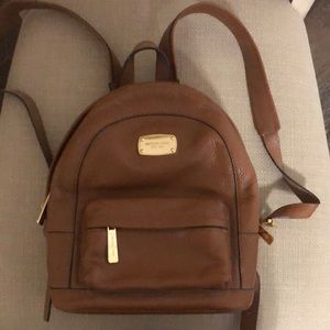 Brown Michael Kors mini backpack purse